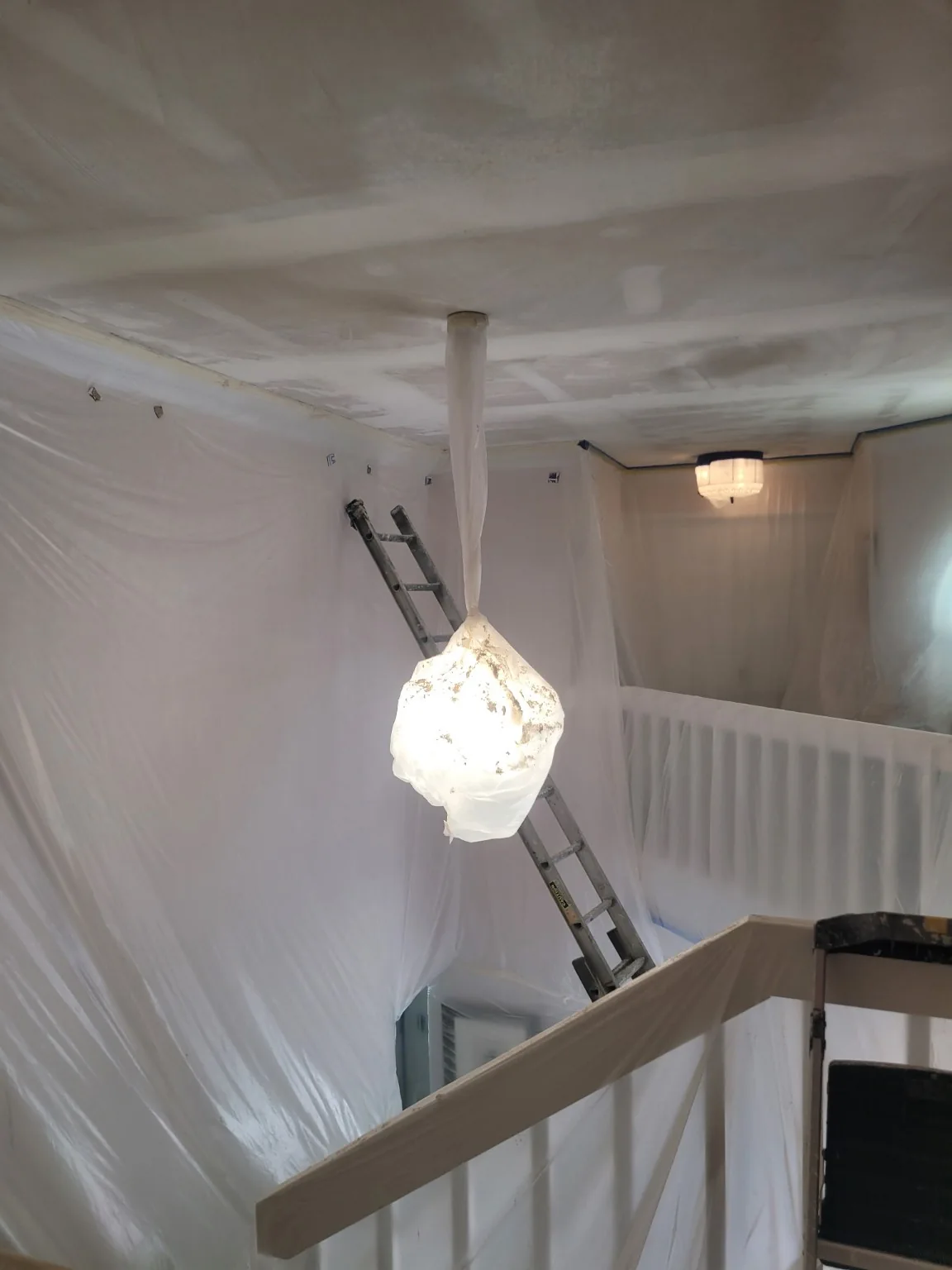 Interior protected with plastic before ceiling work