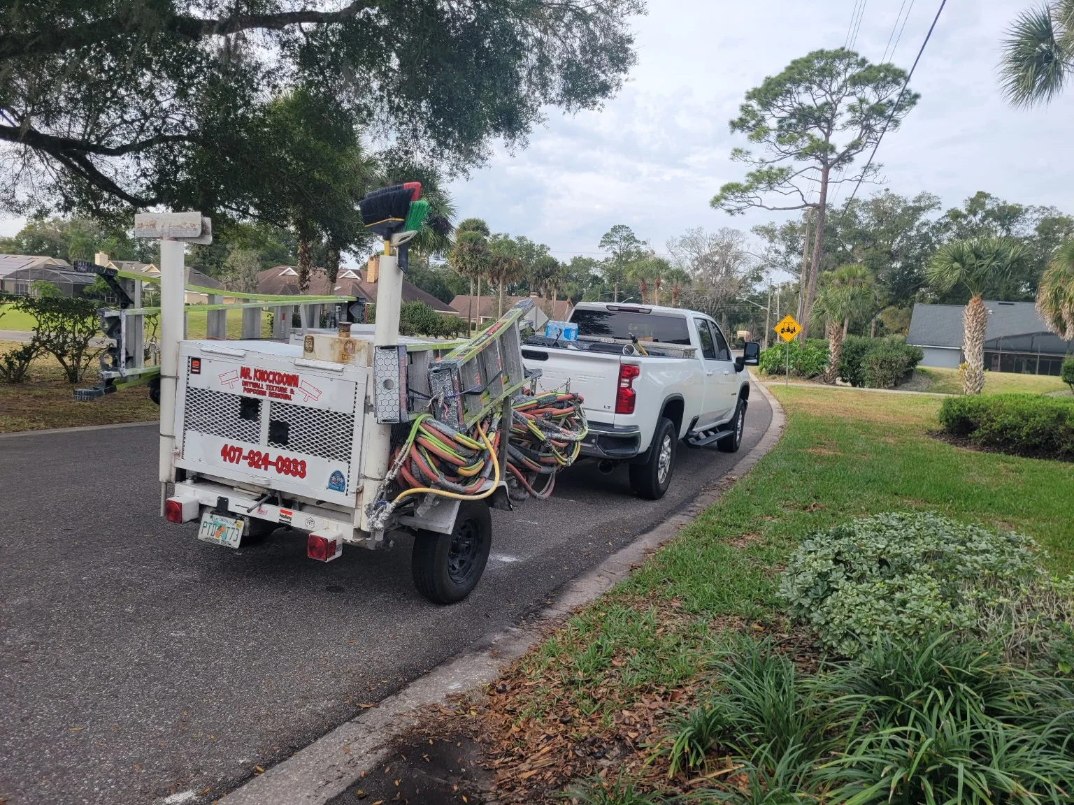 Mr. Knockdown work truck towing professional Desco texture spray rig